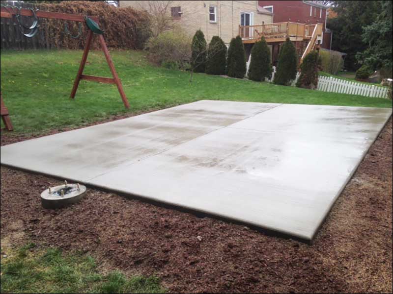 concrete pad with basketball base