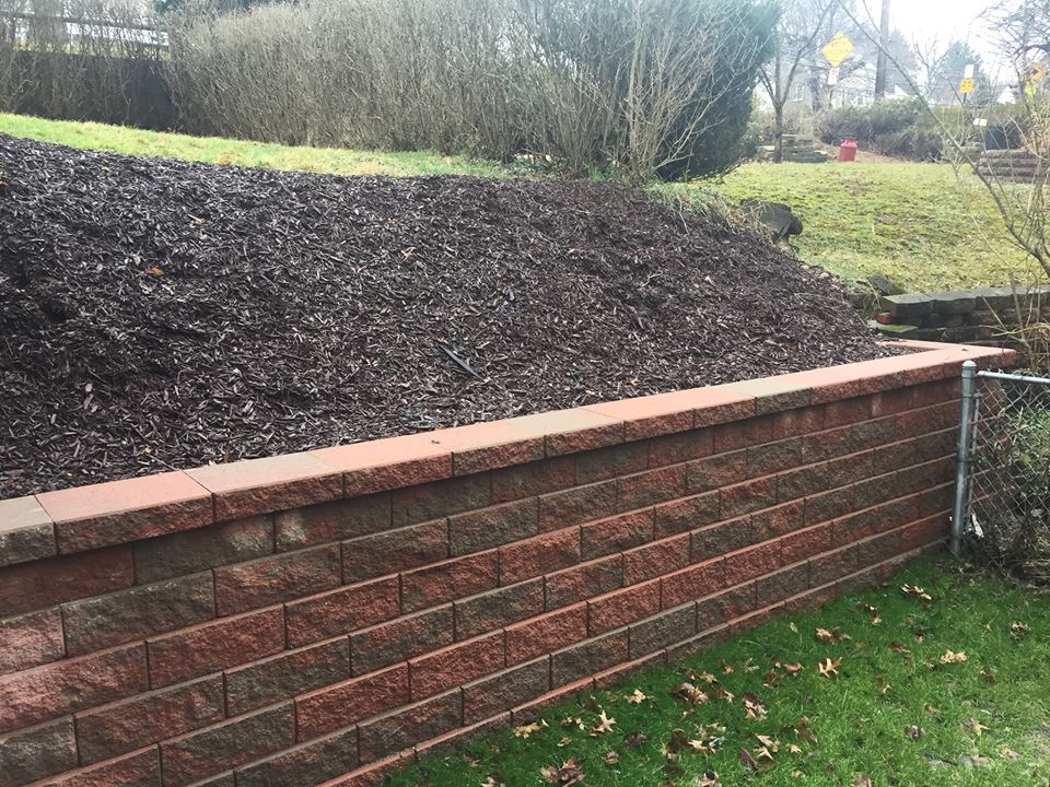 Stone retaining wall & landscaping