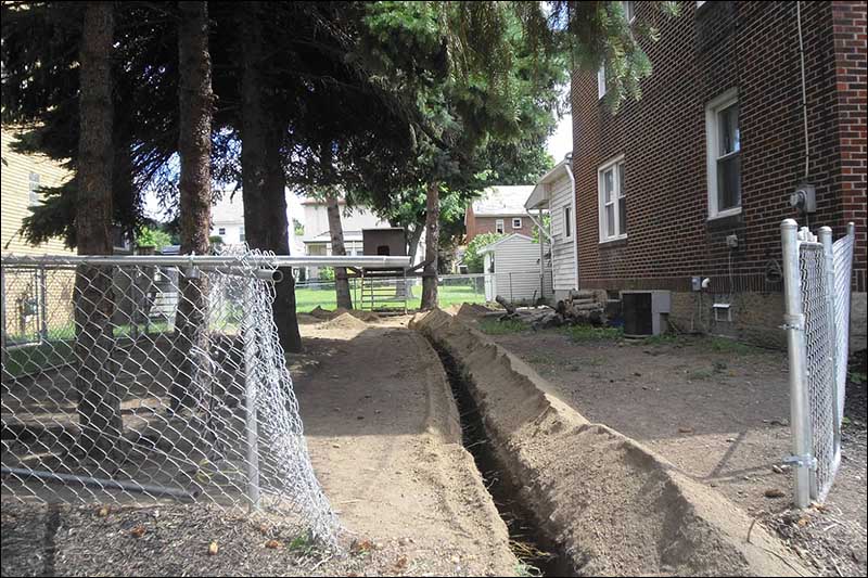 Excavation around fence
